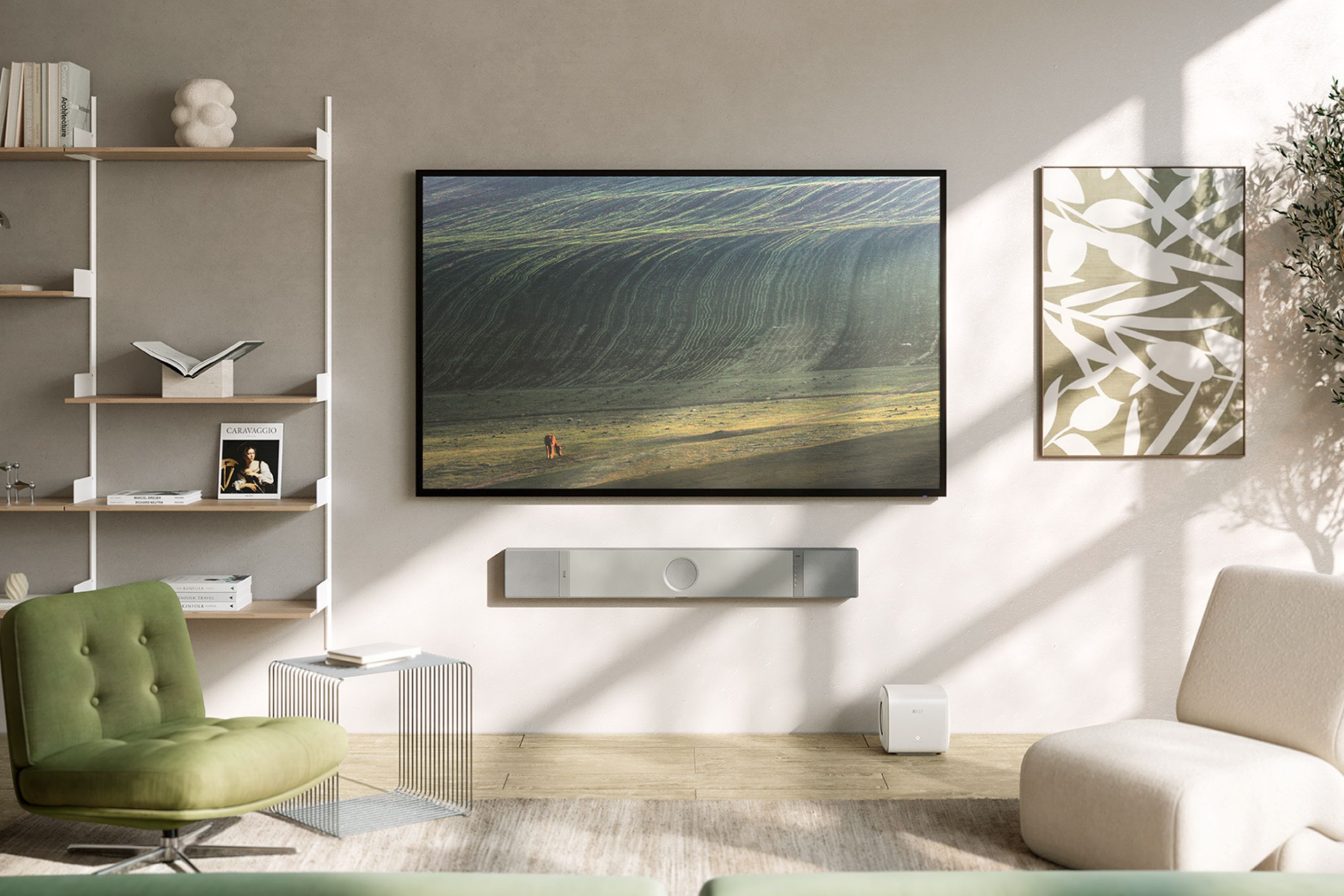 Barre de son KEF XIO fixée au mur sous un téléviseur