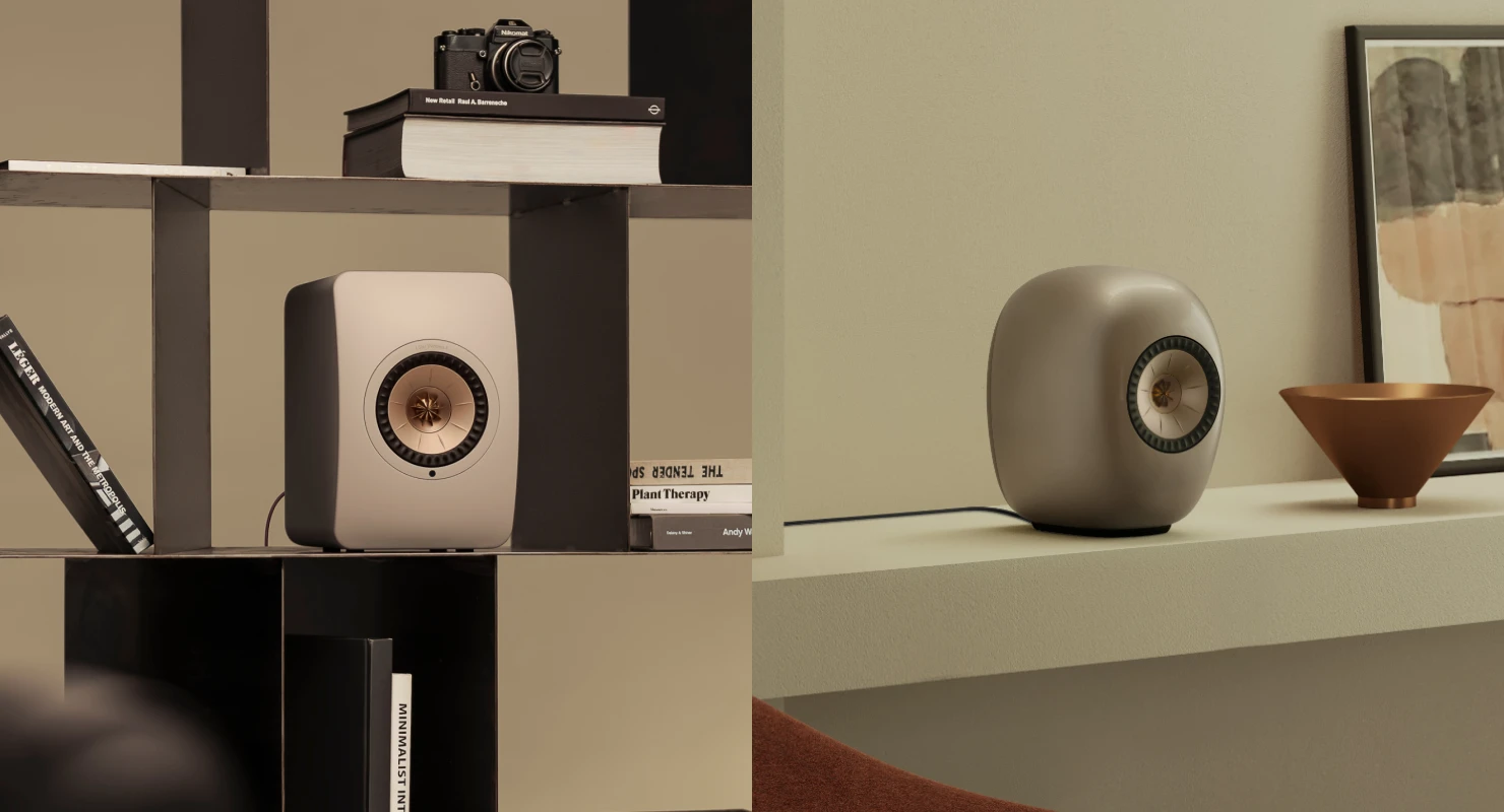 Blue Muo Bluetooth speaker hanging from carrying strap in bathroom is being controlled via phone.