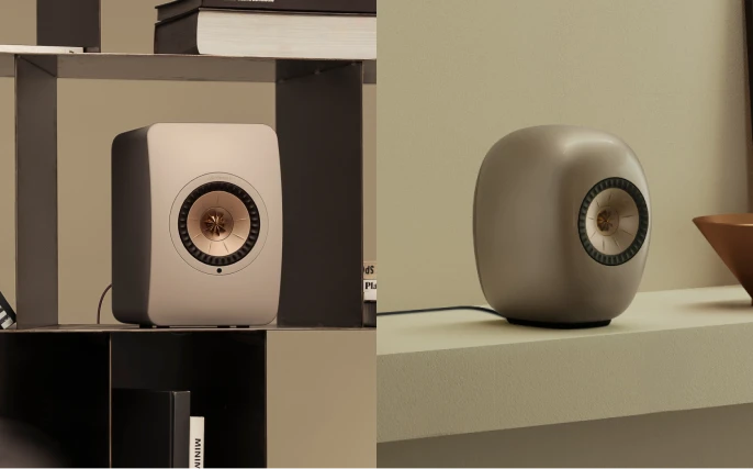Blue Muo Bluetooth speaker hanging from carrying strap in bathroom is being controlled via phone.