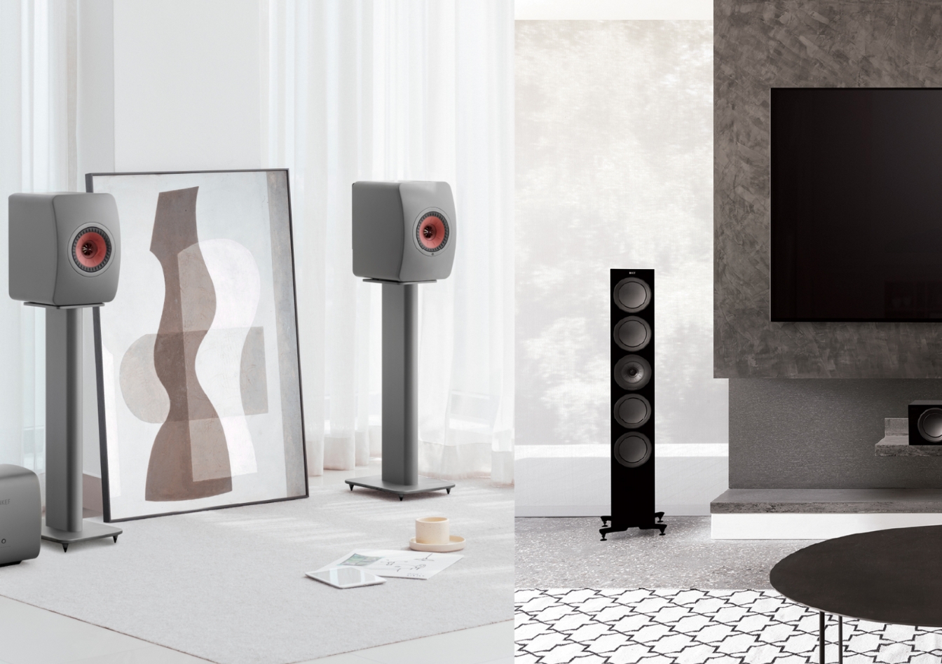 Modern living room with KEF bookshelf speakers on stands and a tall KEF floorstanding speaker setup for high‑end home audio.