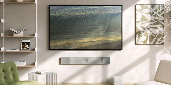 Wall-mounted TV with sleek KEF soundbar in contemporary living room setup