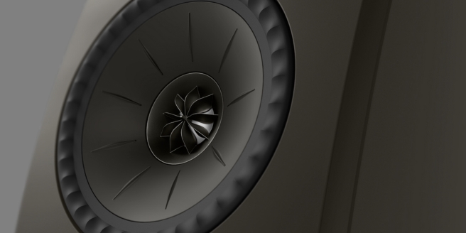 Close-up of a KEF Uni-Q speaker driver highlighting advanced acoustic engineering and sleek, high-fidelity speaker design.