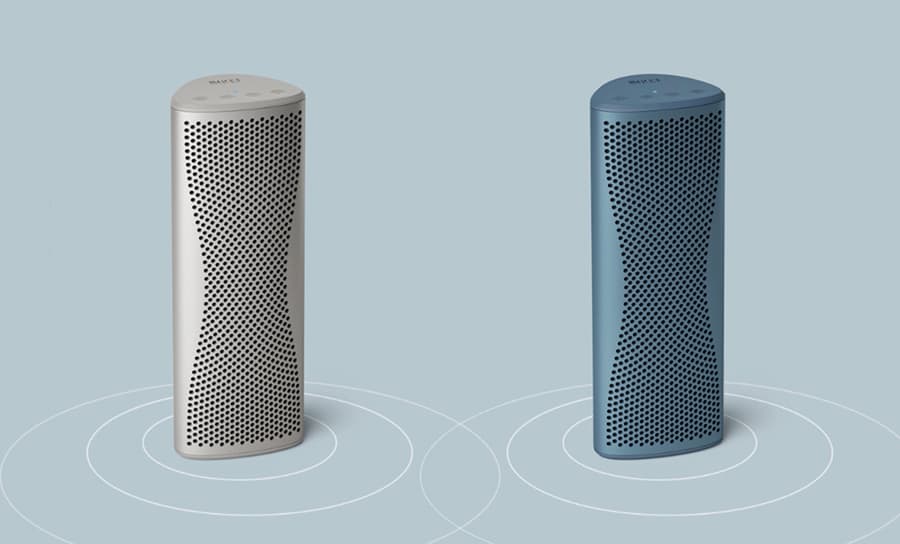 Enceintes portables modernes et élégantes en gris et bleu, conçues avec un motif de grille incurvée pour une performance sonore stylée.
